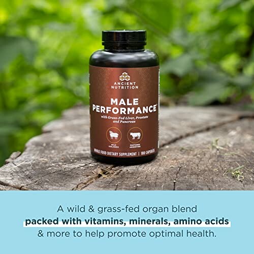 Supplement bottle labeled Male Performance on a tree stump.